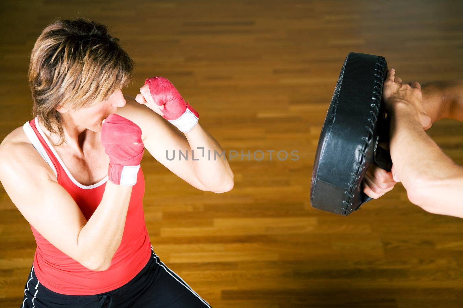 Sparring session in martial arts moves, couple exercising