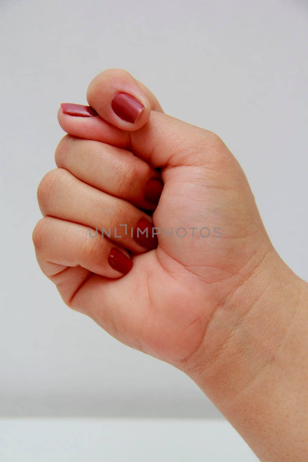 salvador, bahia / brazil - november 10, 2013: woman's hand closed in the shape of a fig.

