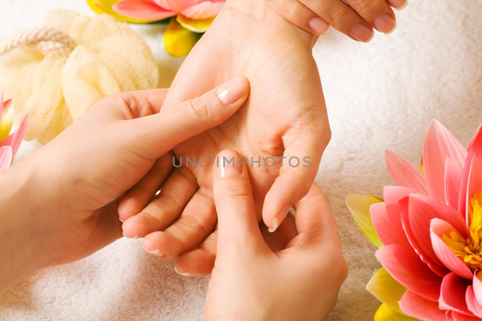 Woman getting a hand massage (close up on hands)