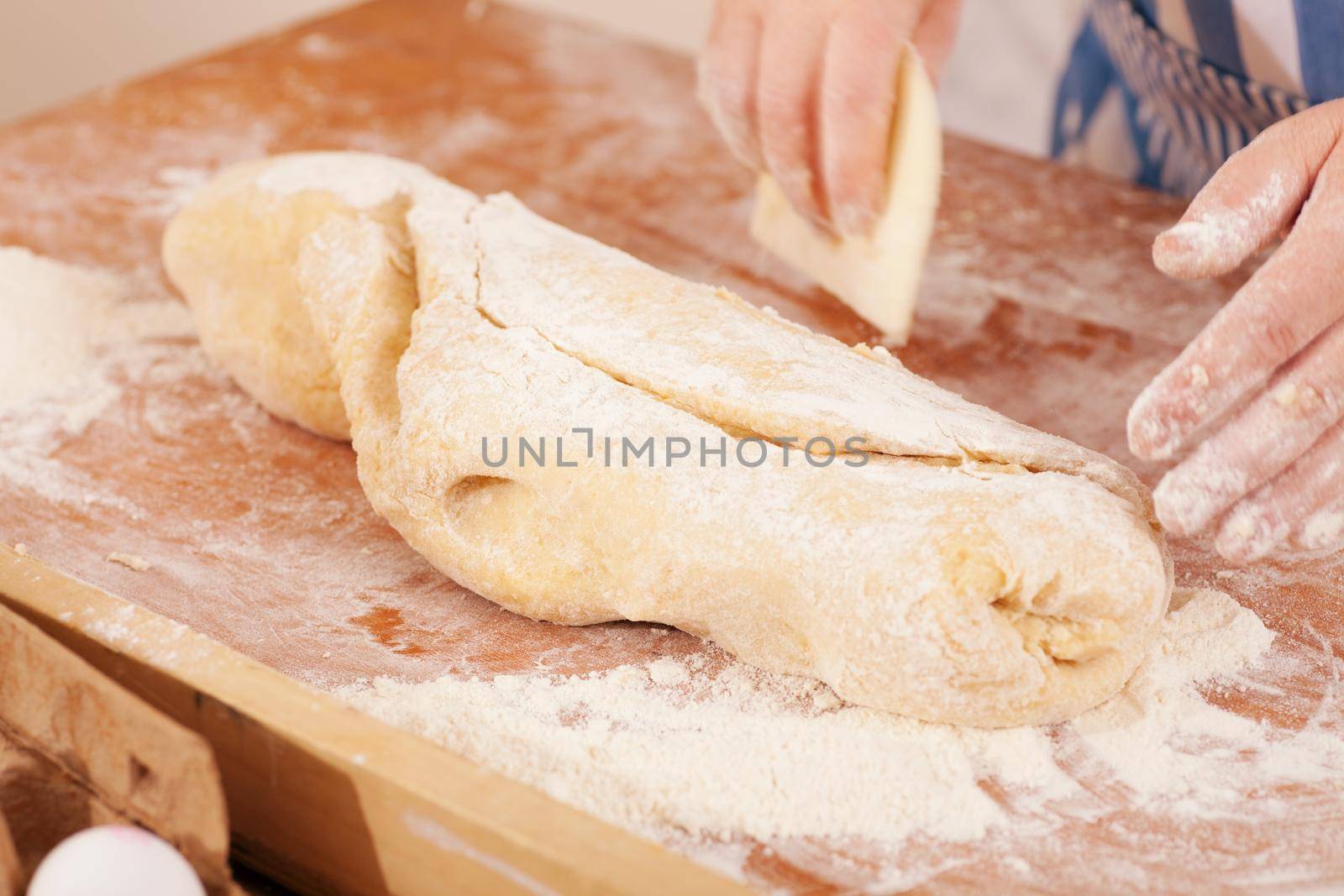 Baking biscuits, woman kneading the dough