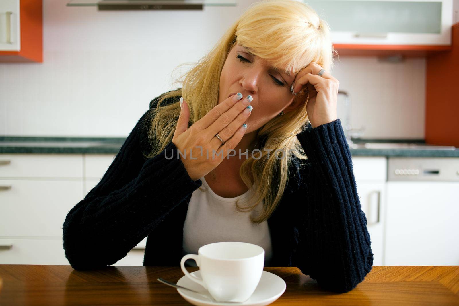 Tired woman yawning by Kzenon