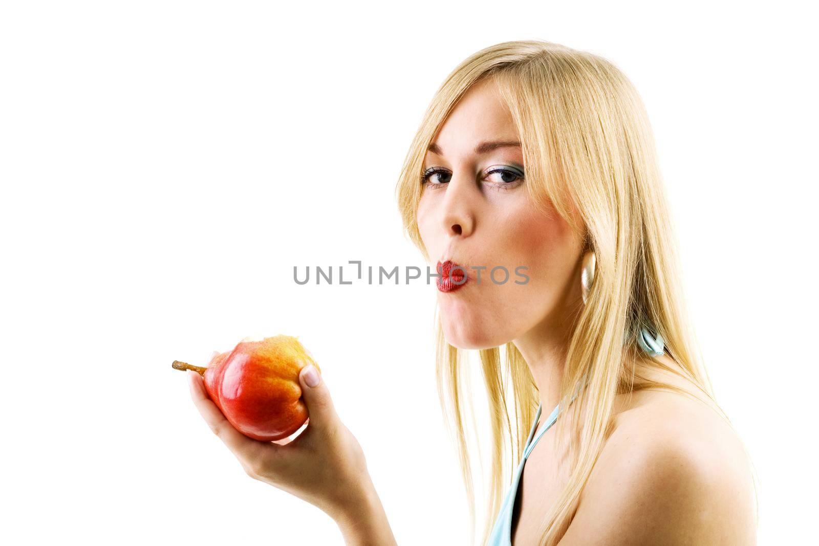 Food, fruit and healthy nutrition - Woman eating a red pear