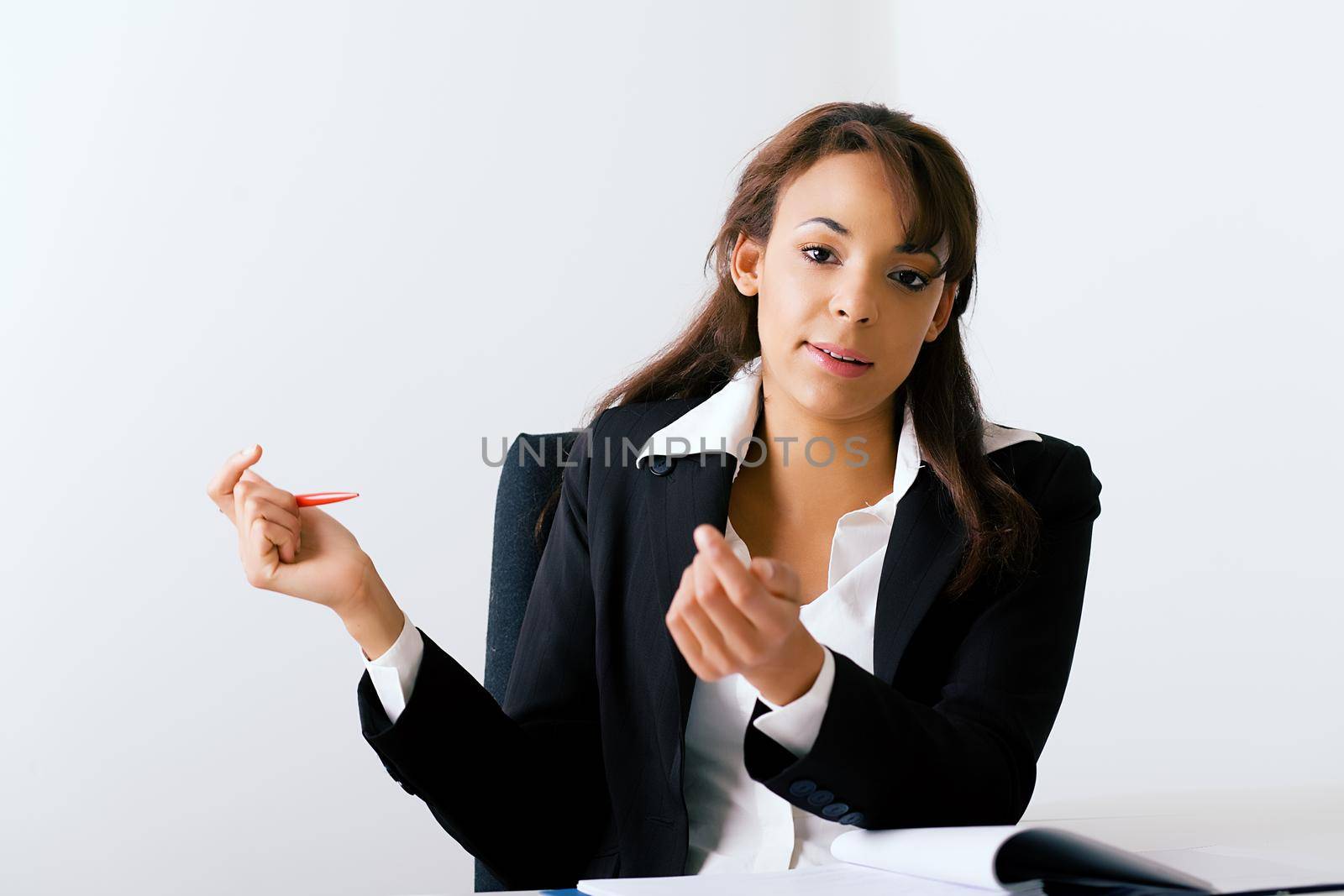 Female office worker gesturing