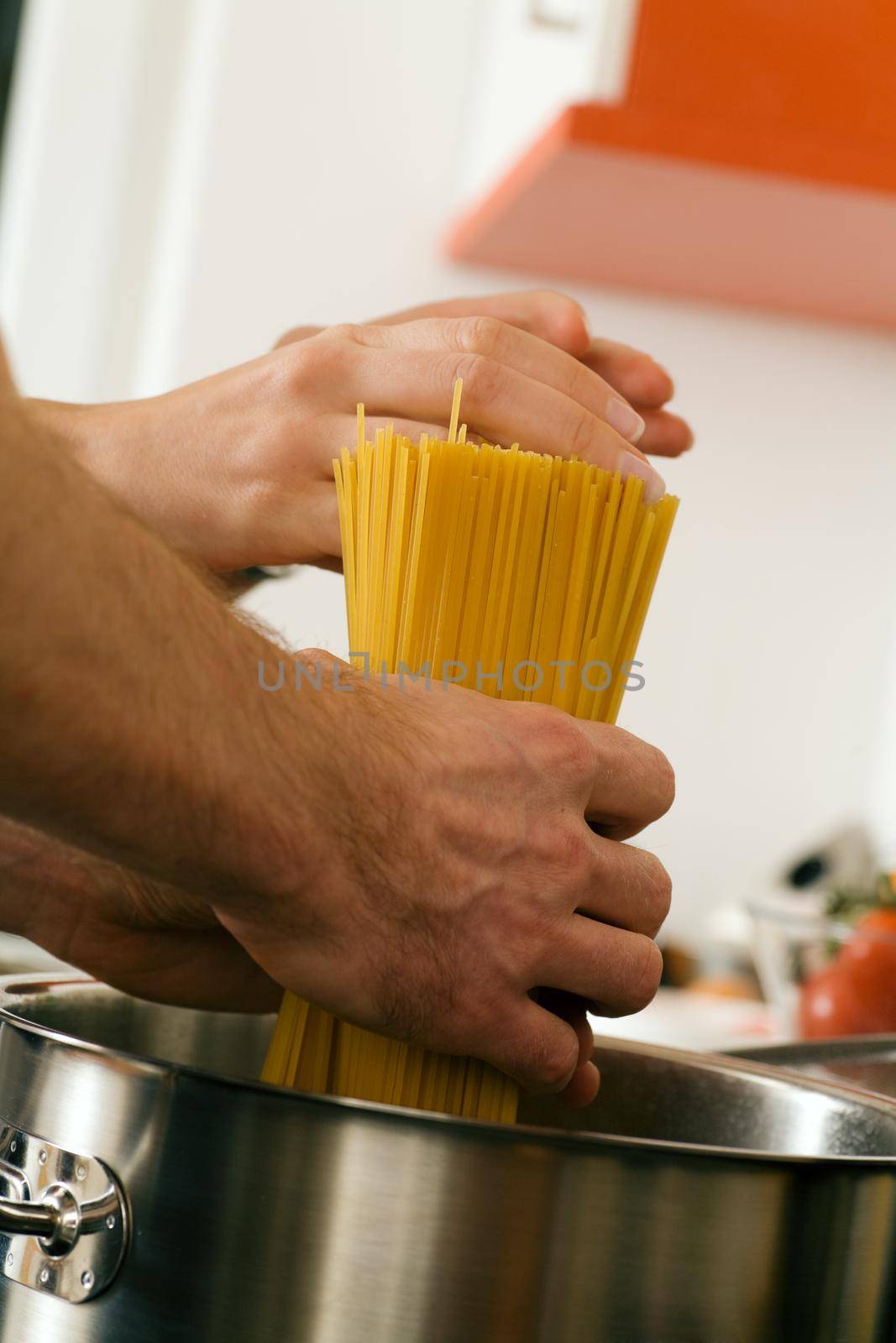 Man cooking pasta by Kzenon