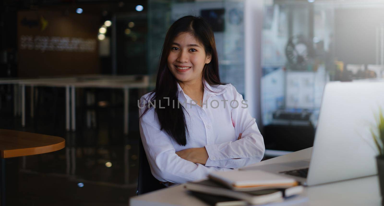 Online class. Happy asian female using laptop for online learning at home