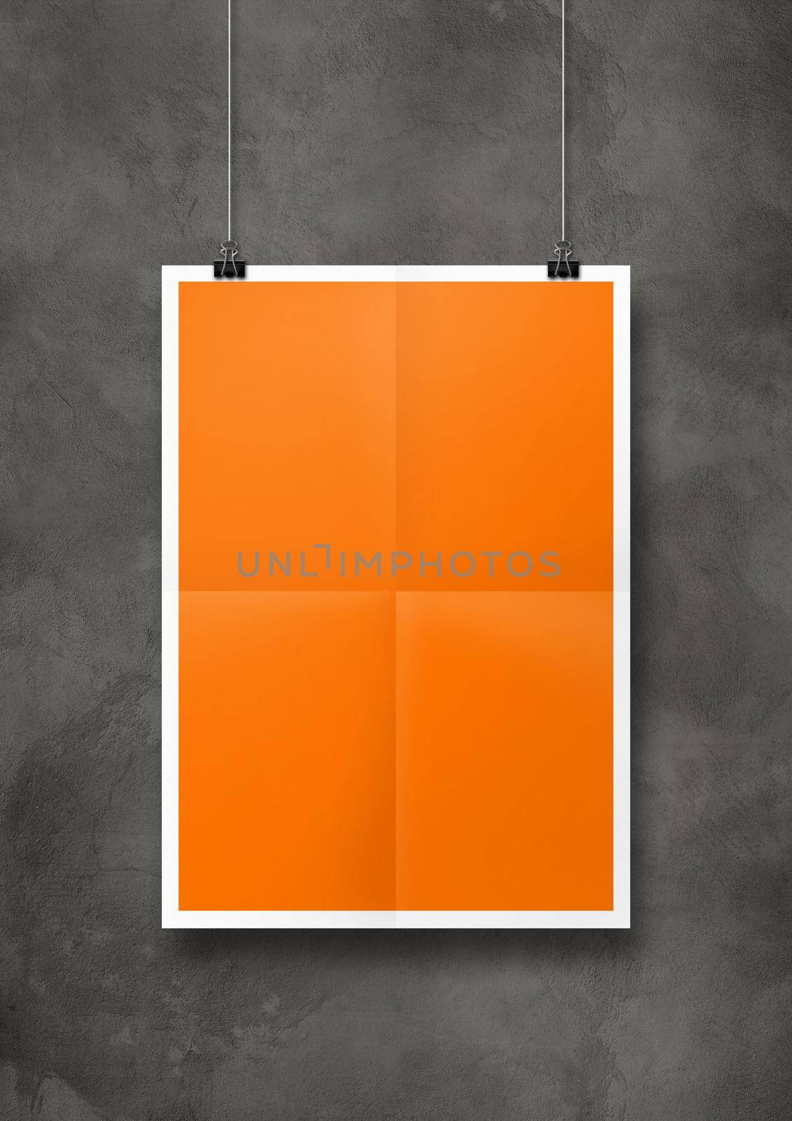 Orange folded poster hanging on a concrete wall with clips by daboost