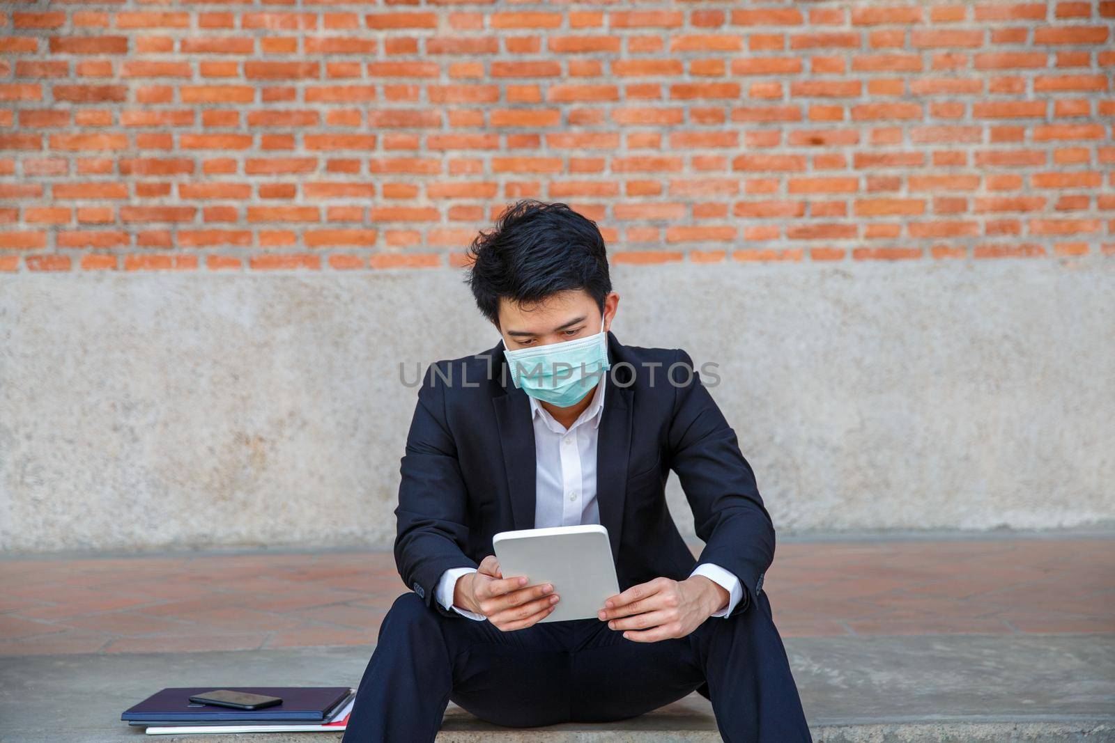 Business man in distress of job losses due to COVID-19 virus pandemic by toa55