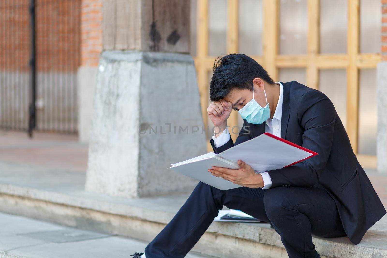 Business man in distress of job losses due to COVID-19 virus pandemic by toa55