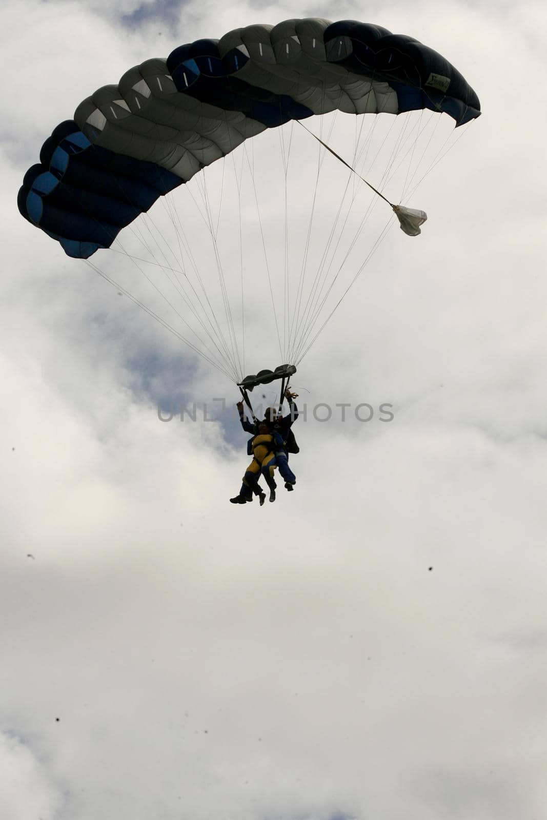 itaparica, bahia / brazil - august 18, 2012: person is seen during a parachute jump on the island of Itaparica.