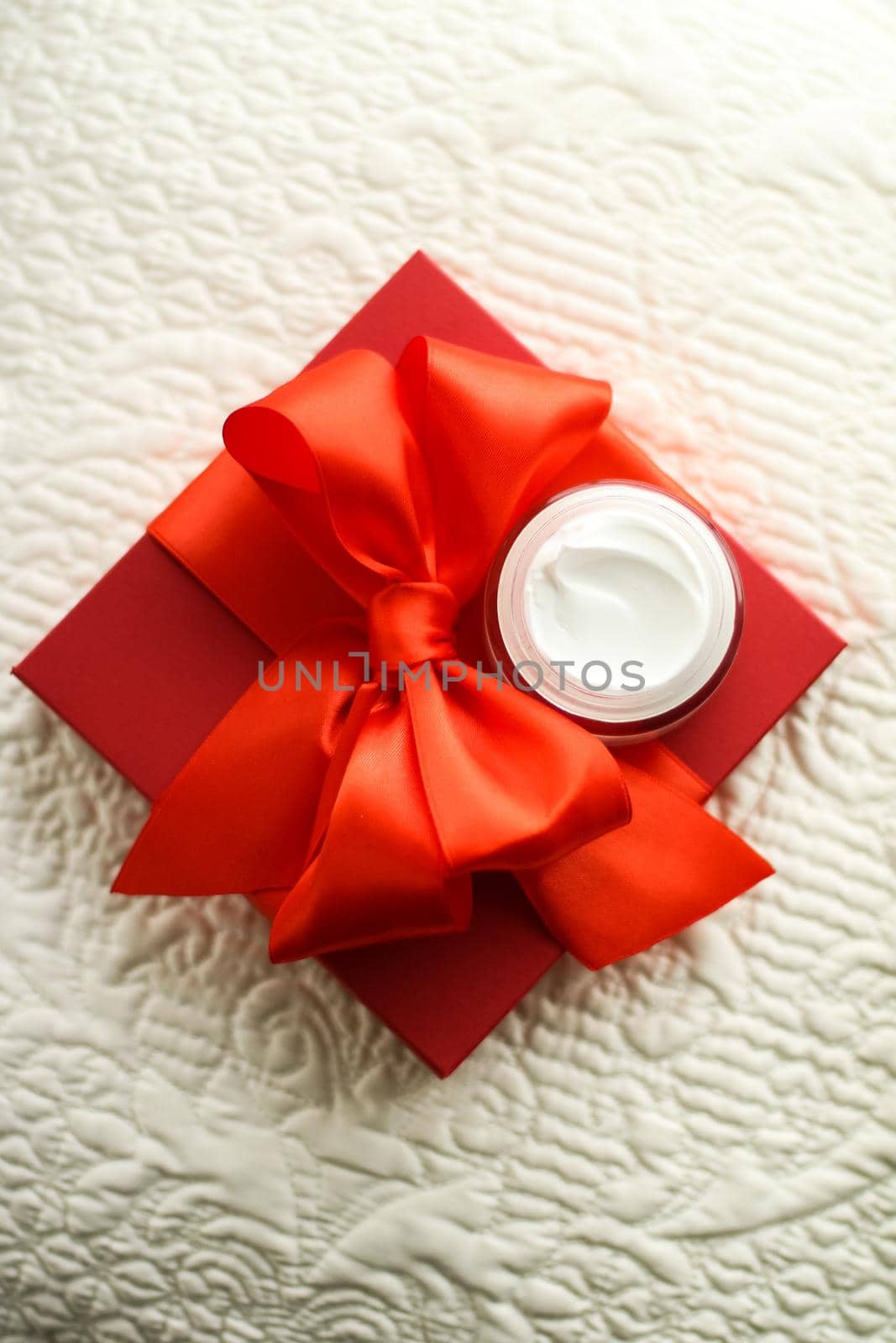 Beauty, cosmetics and skincare styled concept - Luxury face cream jar and red gift box