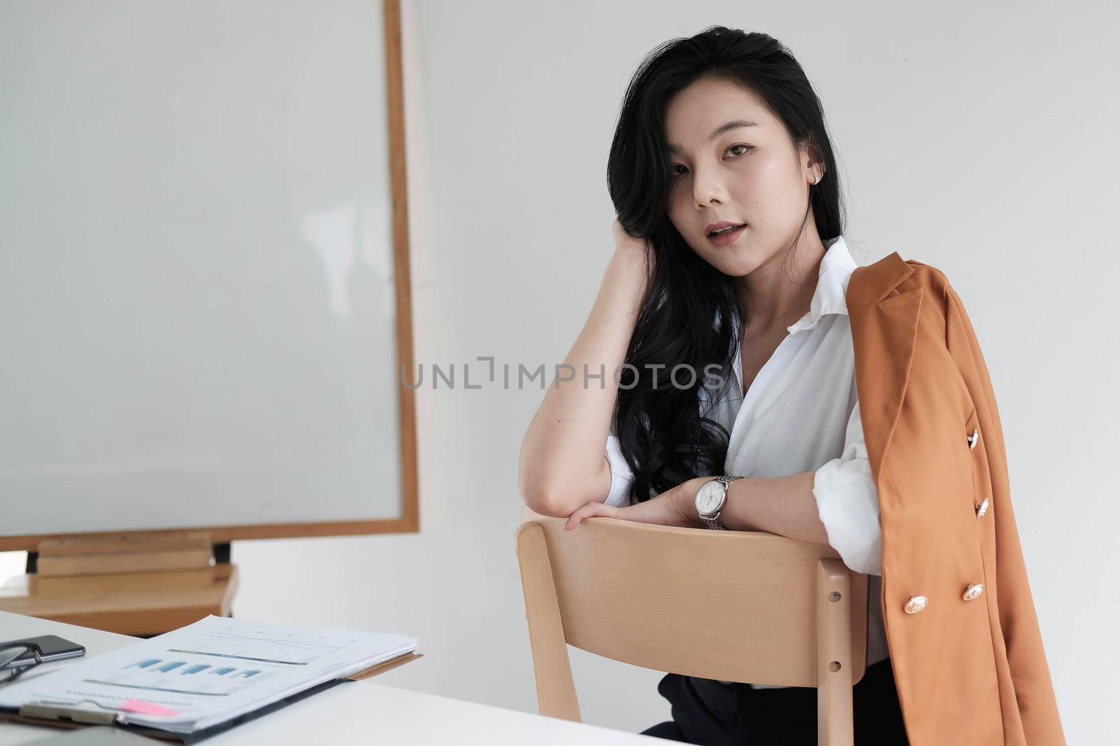 Portrait Of Attractive Asian Businesswoman Working for marketing plan.