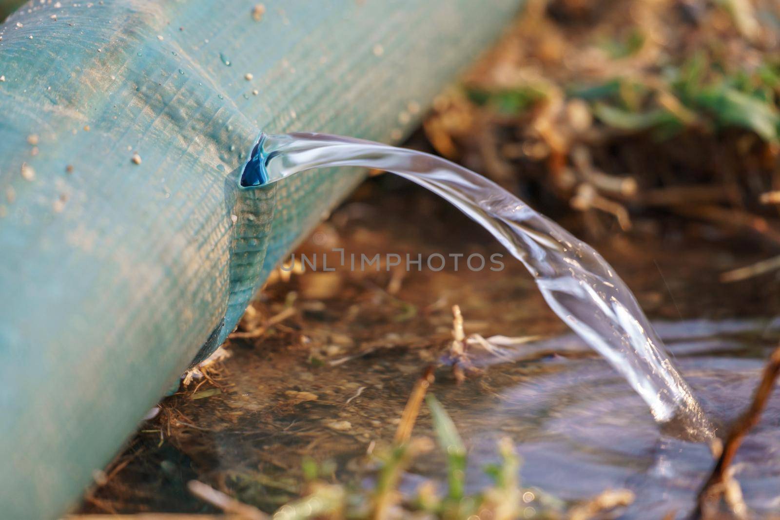 water leaking from hole in a industrial hose. by toa55