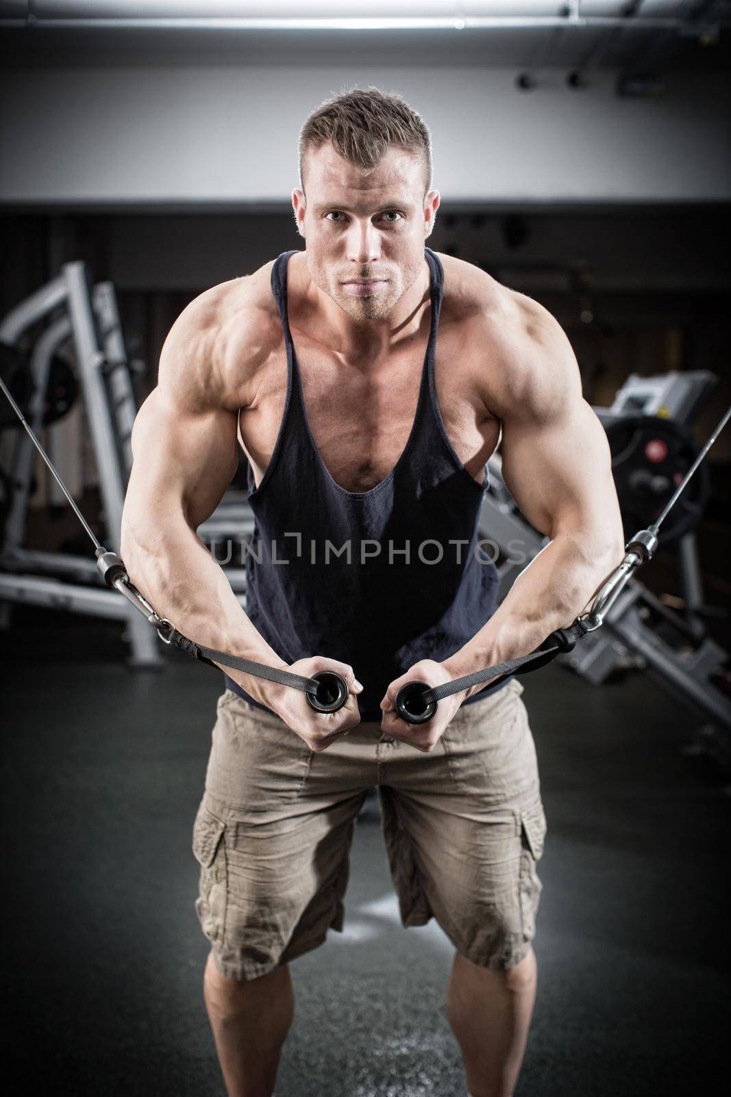 Bodybuilder doing butterfly on cable pull by Kzenon