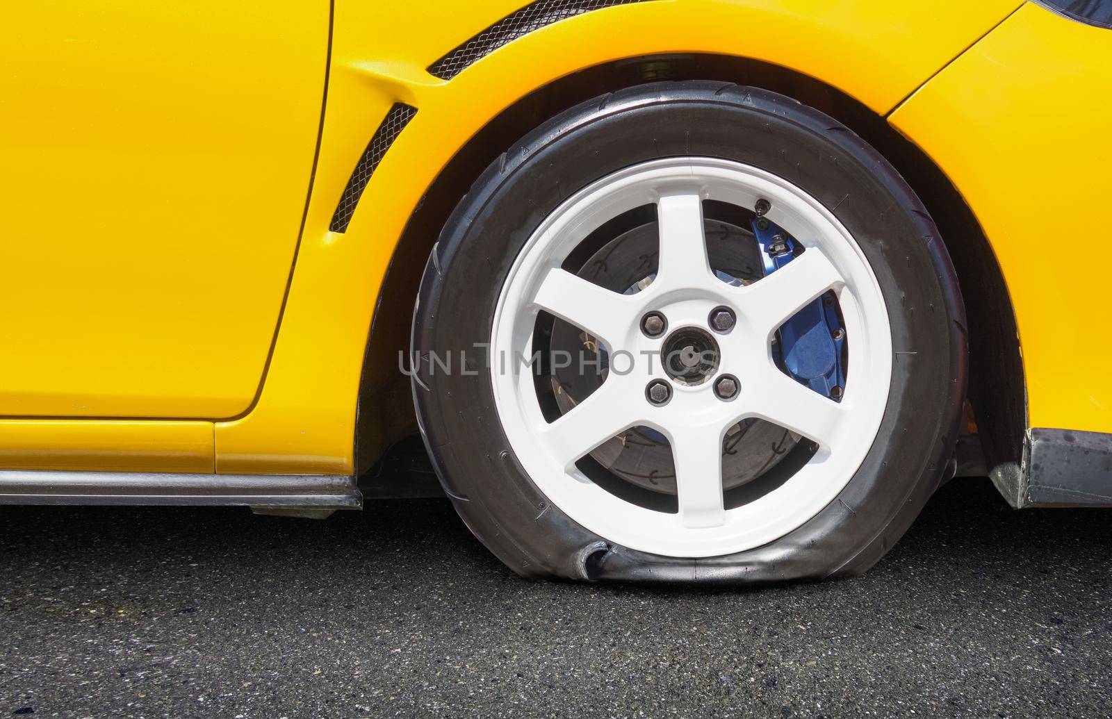 burst car tire on road by toa55