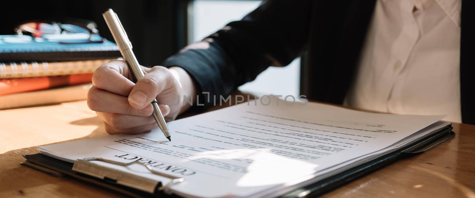 Real estate agent sign a contract documents agreement with customer to sign contract by nateemee