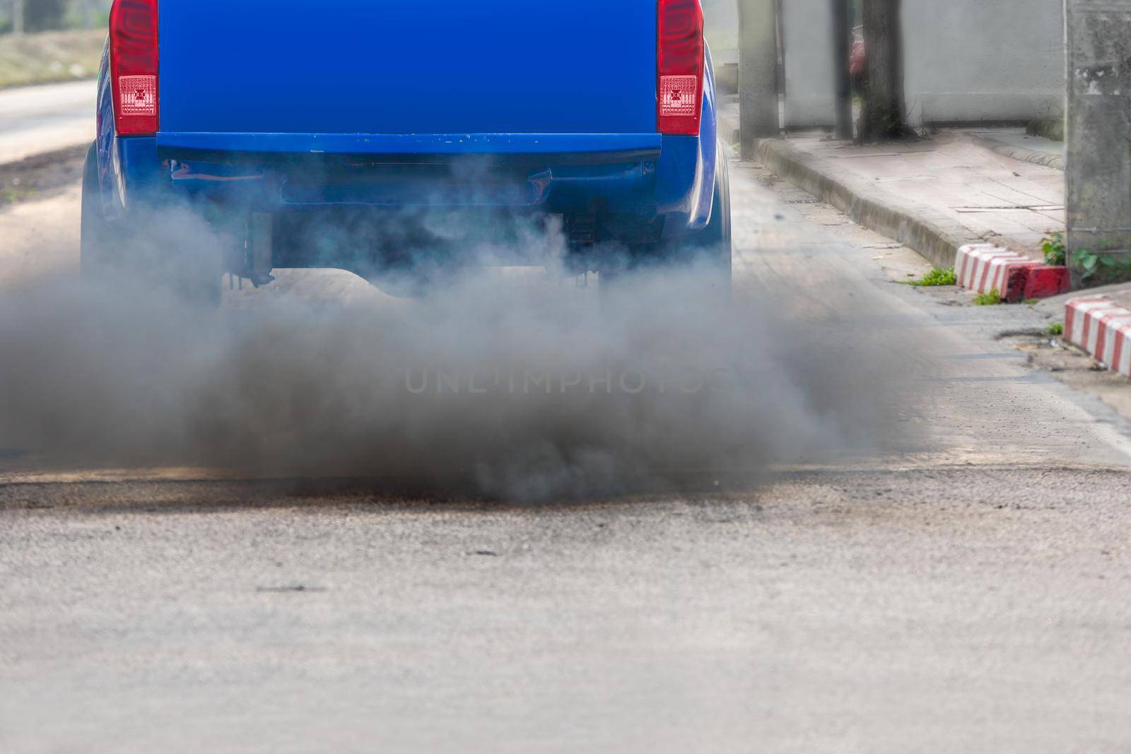 air pollution crisis in city from diesel vehicle exhaust pipe on road by toa55