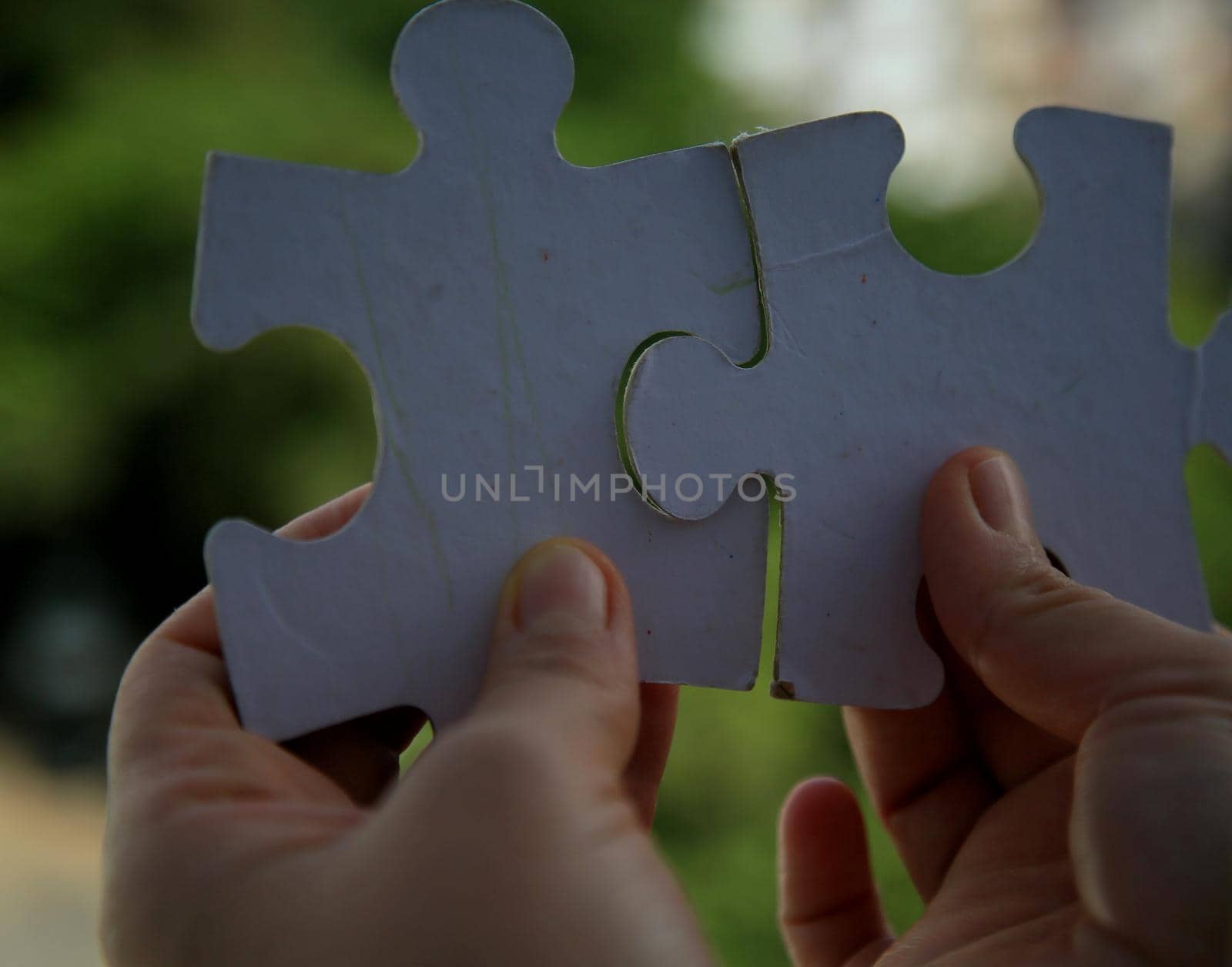 salvador, bahia / brazil - july 15, 2020: hand holds puzzle pieces in the city of Salvador.