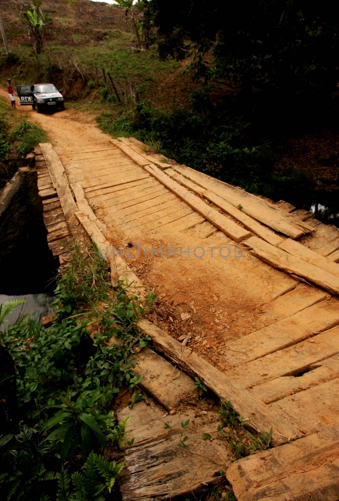 guaratinga, bahia / brazil - august 18, 2010: The wooden bridge over the Mineiro stream in the rural area of the city of Guaratinga.
