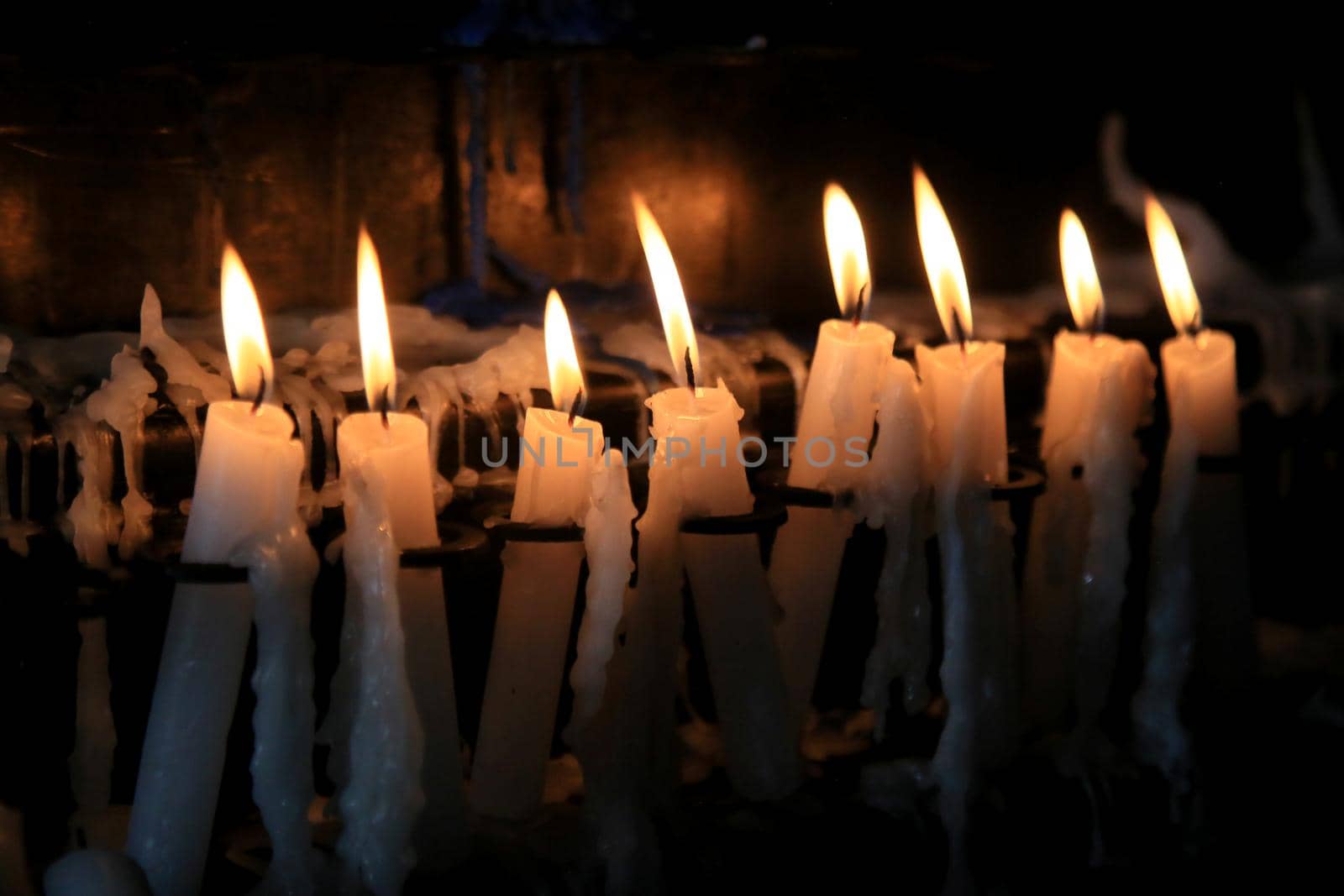salvador, bahia, brazil - january 13, 2021: lighted candles are seen near the Nosso Senhor do Bonfim church in the city of Salvador.