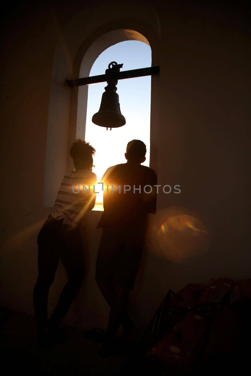 madre de desus, bahia / brazil - october 21, 2017: people are seen jutos the church bell in the city of Madre de Deus.