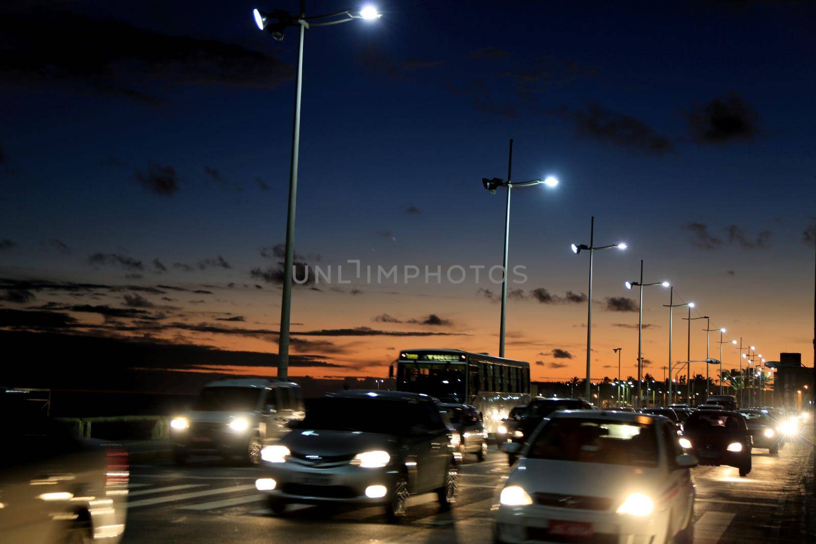 salvador, bahia / brazil - january 20, 2015: vehicles are seen passing through the Pituba neighborhood in the city of Salvador in a place with LED lighting on the road.