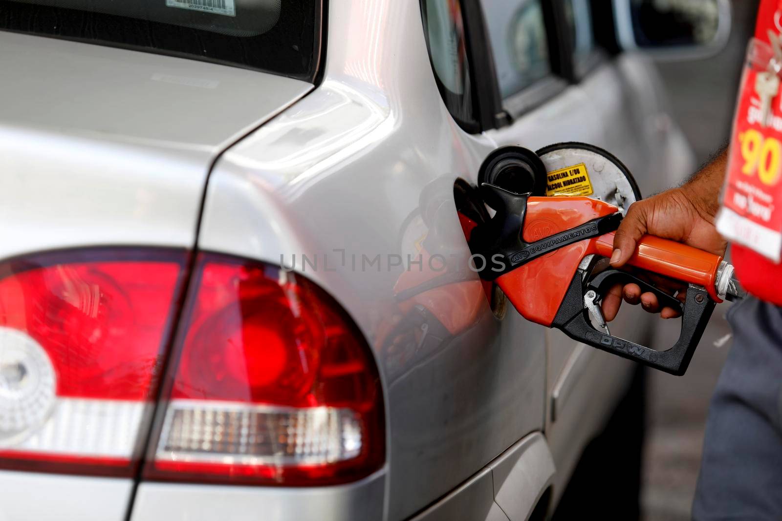 salvador, bahia / brazil - august 20, 2019: gas station attendant is seen fueling a vehicle at a gas station in the city of Salvador.
