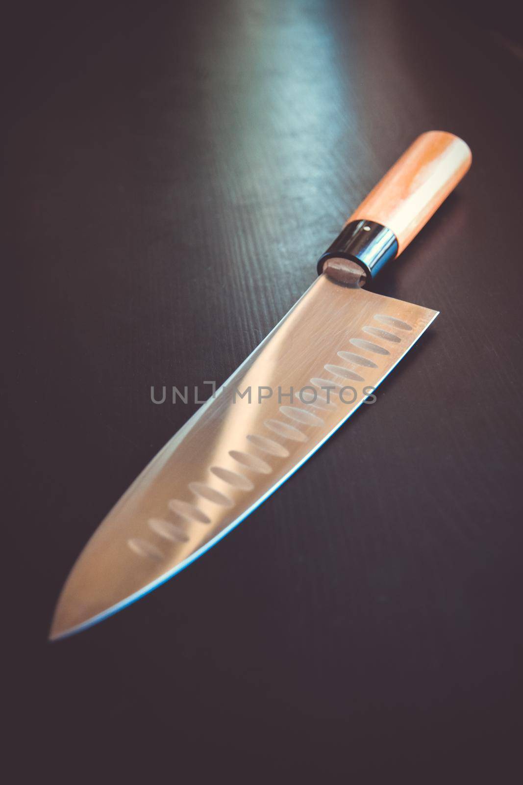 Traditional Japanese gyuto chief knife on black table