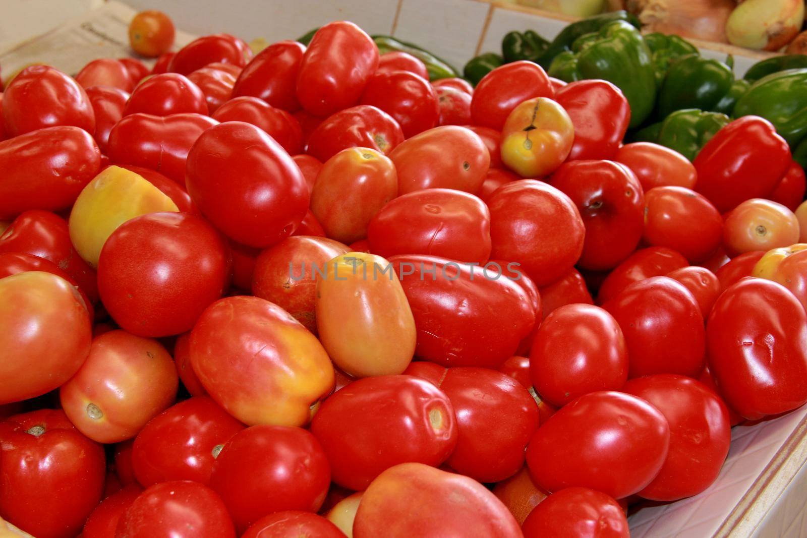 conde, bahia / brazil - september 17, 2012: tomatoes are seen for sale at an open market in the city of Conde.
