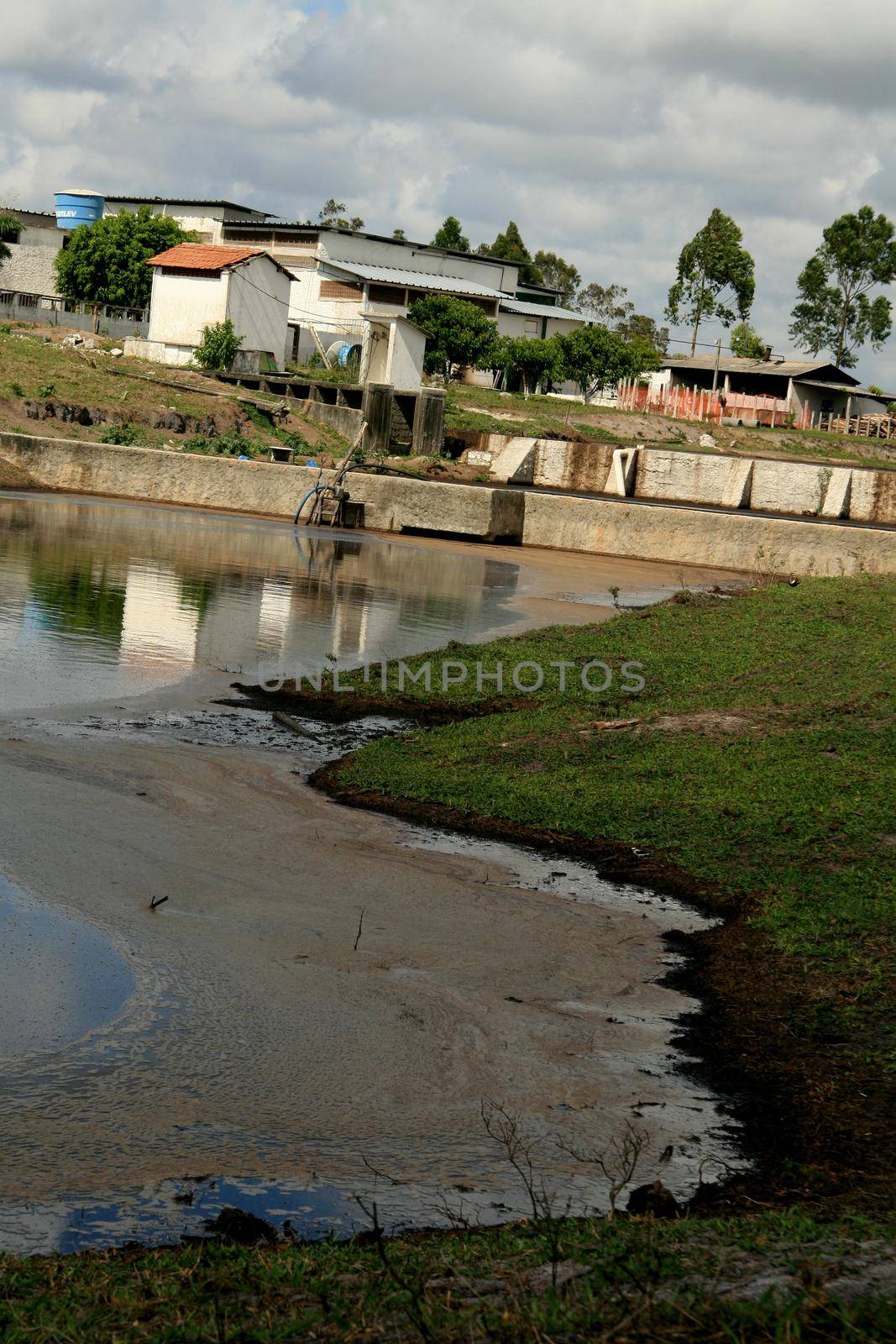 eunapolis, bahia / brazil - october 21, 2008: industrial waste water pond is seen in the city of Eunapolis, in southern Bahia.


