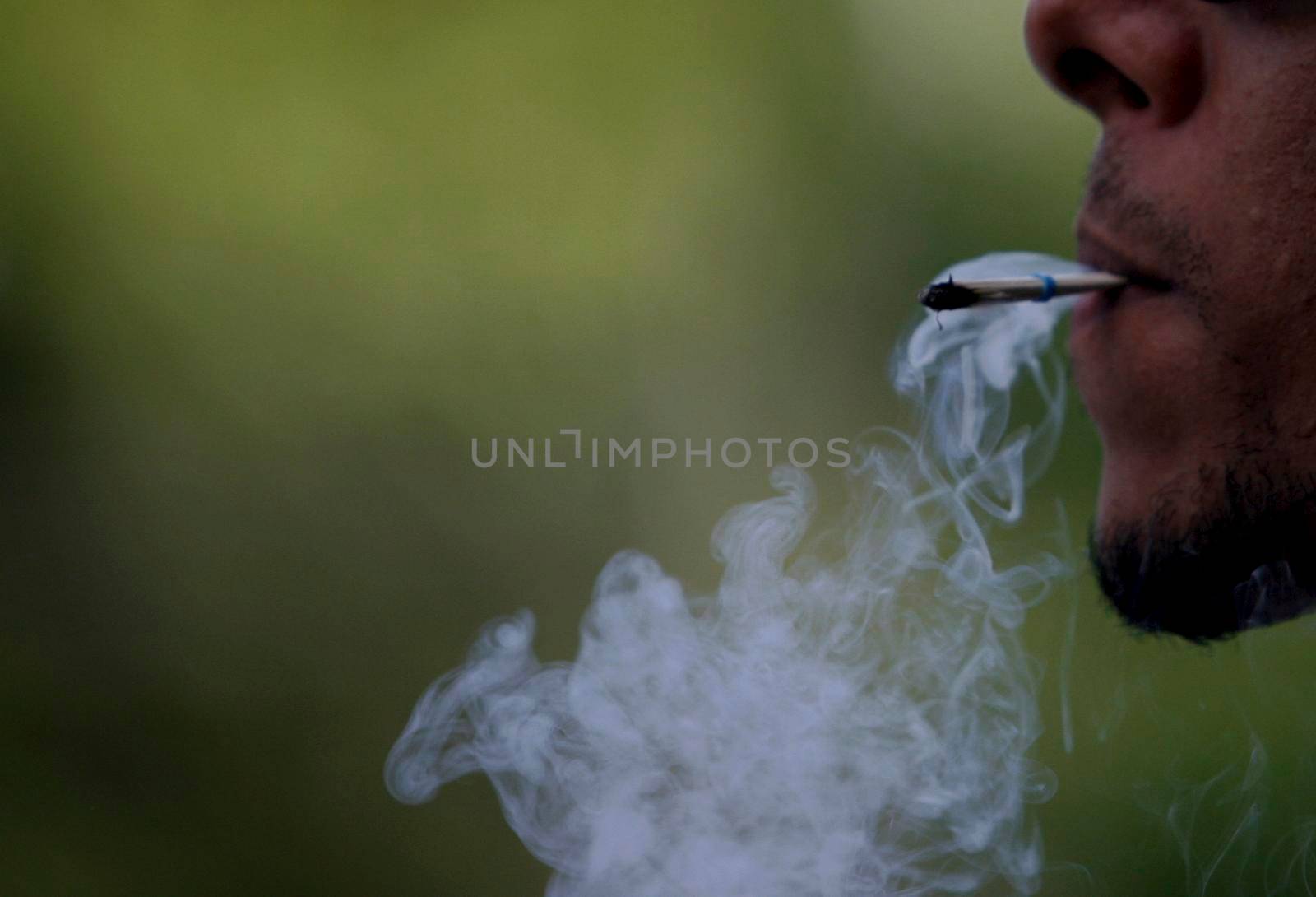 person smoking straw cigarette by joasouza