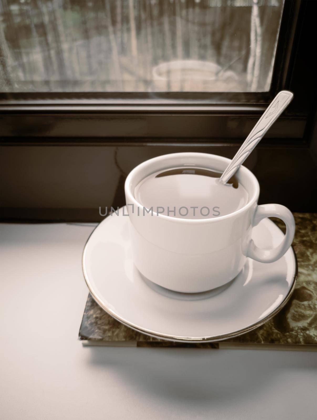 A Cup of tea and a book on the windowsill by georgina198