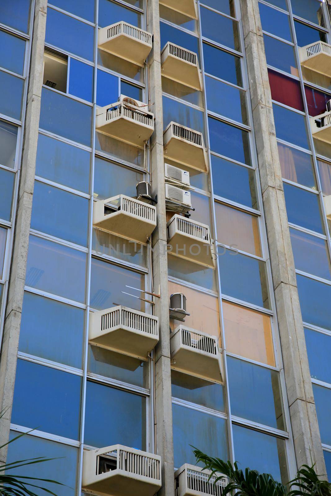 salvador, bahia, brazil - january 25, 2021: air conditioners are seen on the facade of a commercial building in the city of Salvador.