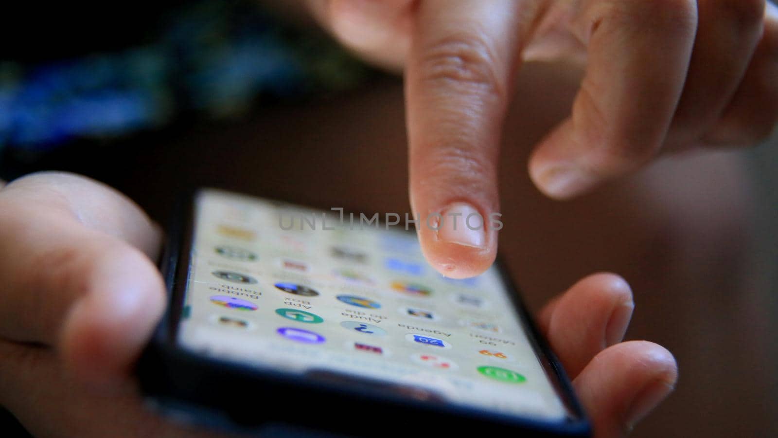 salvador, bahia / brazil - june 22, 2020: person is seen using smartphone in the city of Salvador.
