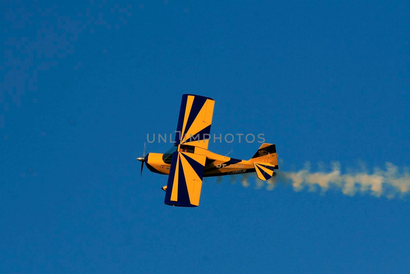 porto seguro, bahia / brazil - october 25, 2008: Small aircraft is seen during maneuvers at an air show with experimental aircraft in the city of Porto Seguro.

 
