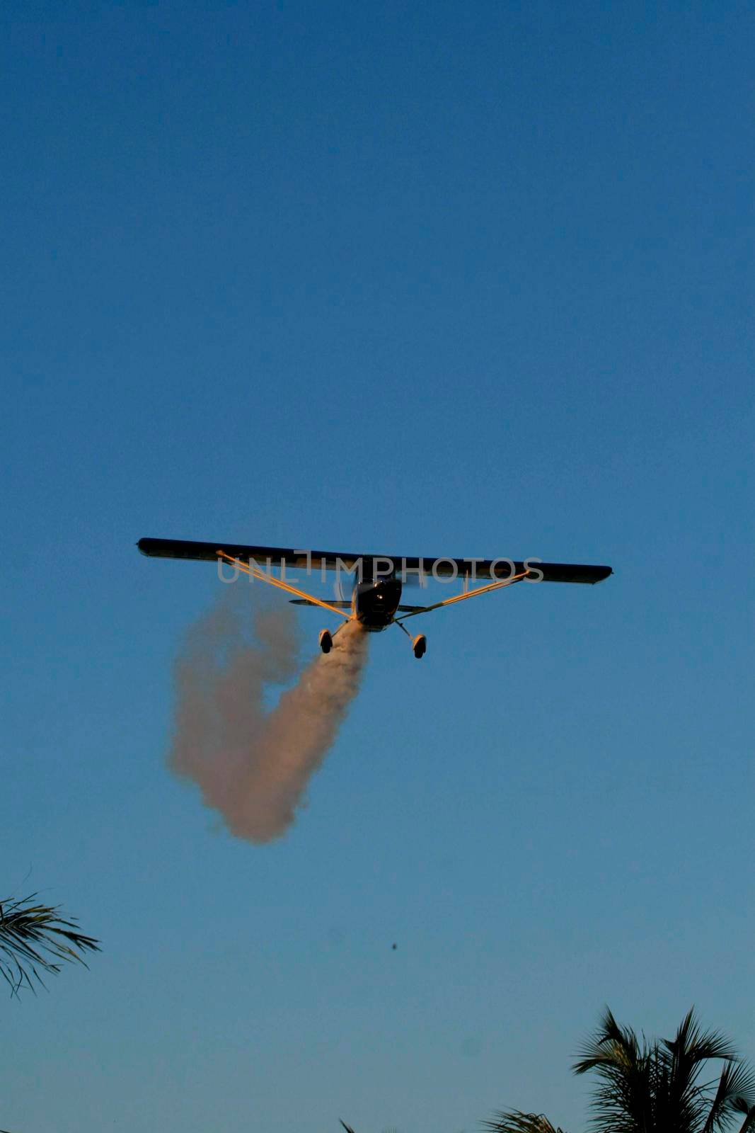 porto seguro, bahia / brazil - october 25, 2008: Small aircraft is seen during maneuvers at an air show with experimental aircraft in the city of Porto Seguro.

 