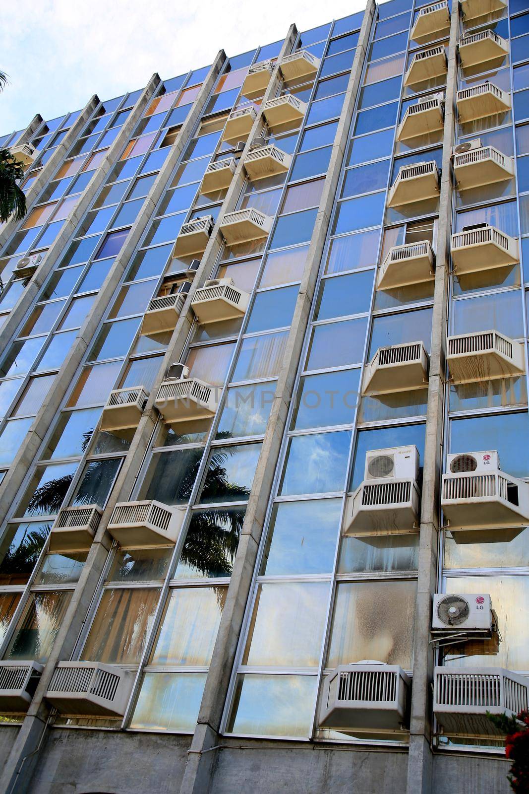 air conditioners on commercial building facade by joasouza