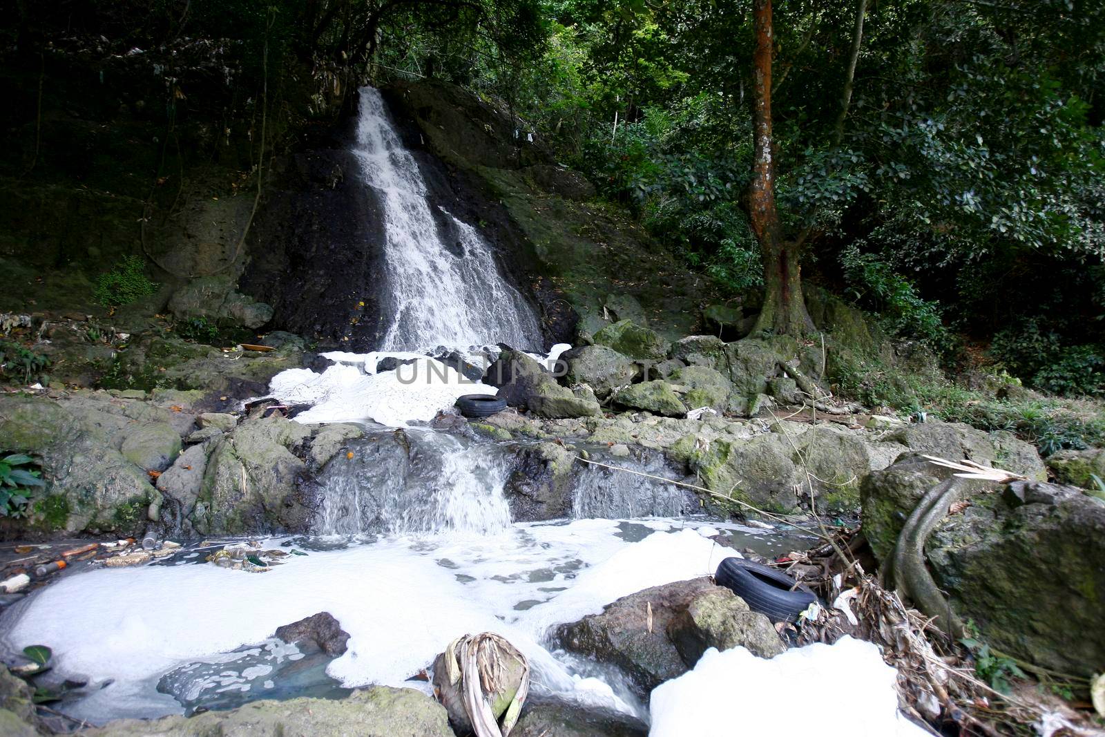 salvador, bahia / brazil - september 30, 2014: view of the Oxum waterfall in Parque Sao Bartolomeu in the city of Salvador. the place is considered sacred for Candomble practitioners.
