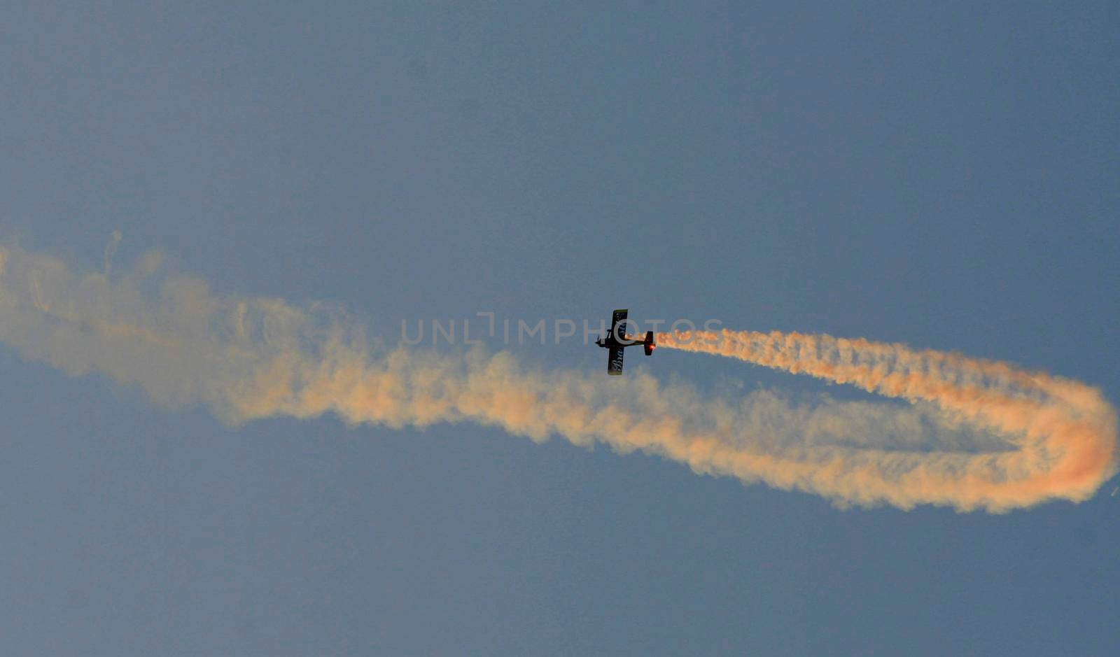 porto seguro, bahia / brazil - october 25, 2008: Small aircraft is seen during maneuvers at an air show with experimental aircraft in the city of Porto Seguro.

 