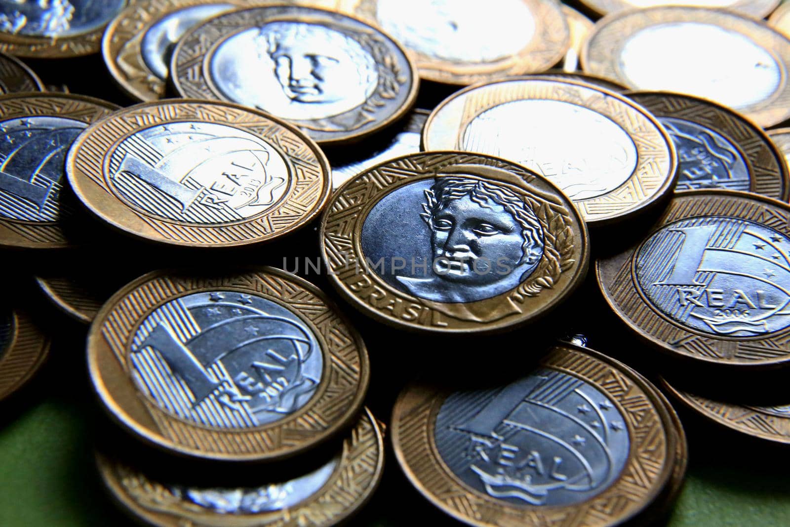 salvador, bahia / brazil - january 23, 2015: Heaped real coins forming collection in the city of Salvador.

