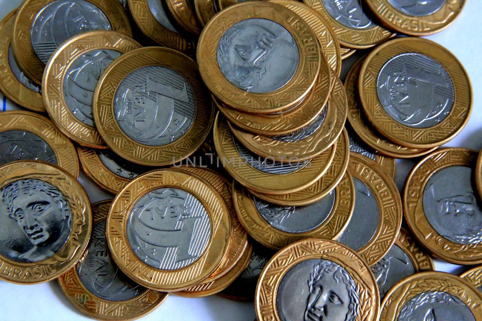 salvador, bahia / brazil - january 23, 2015: Heaped real coins forming collection in the city of Salvador.

