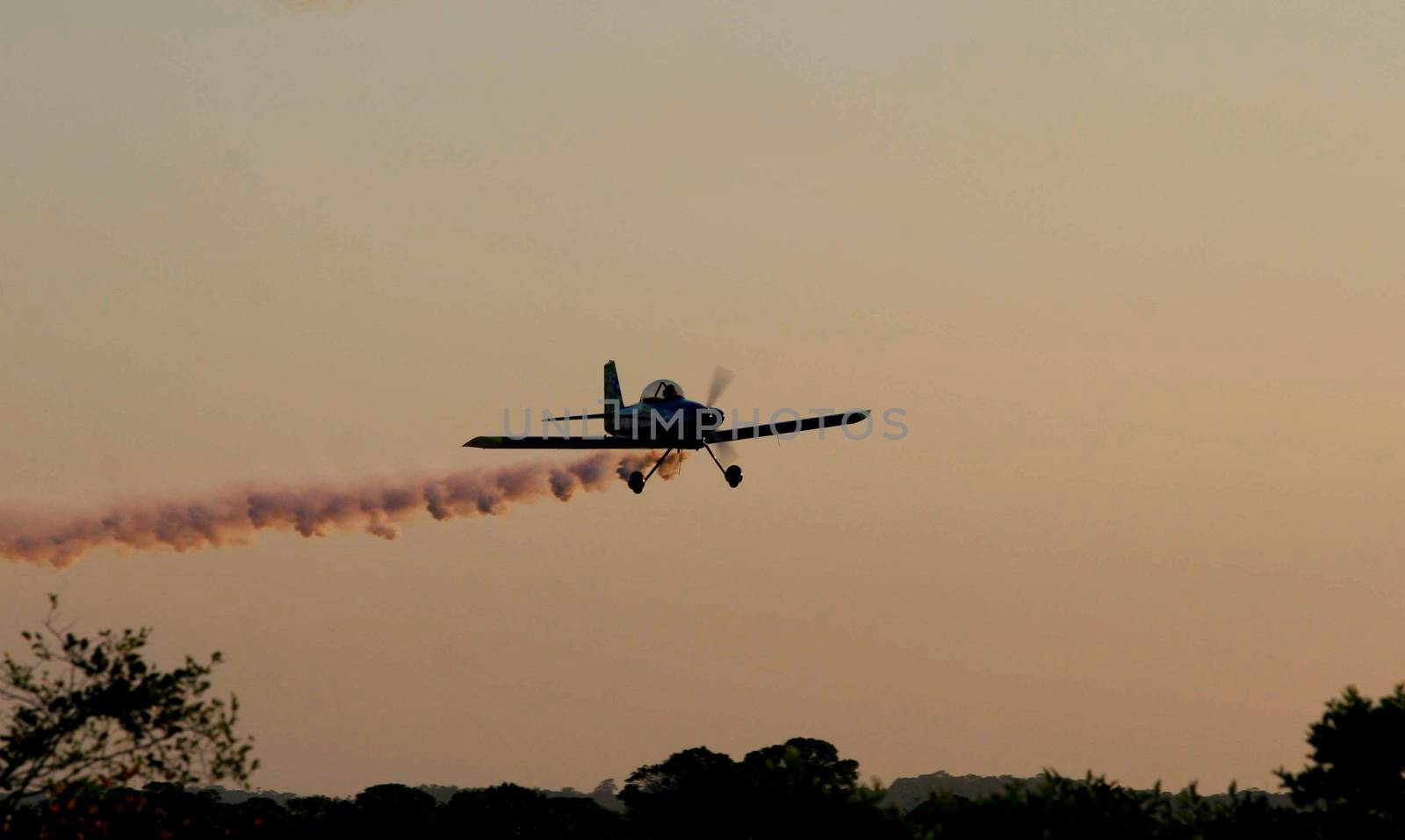 porto seguro, bahia / brazil - october 25, 2008: Small aircraft is seen during maneuvers at an air show with experimental aircraft in the city of Porto Seguro.

 