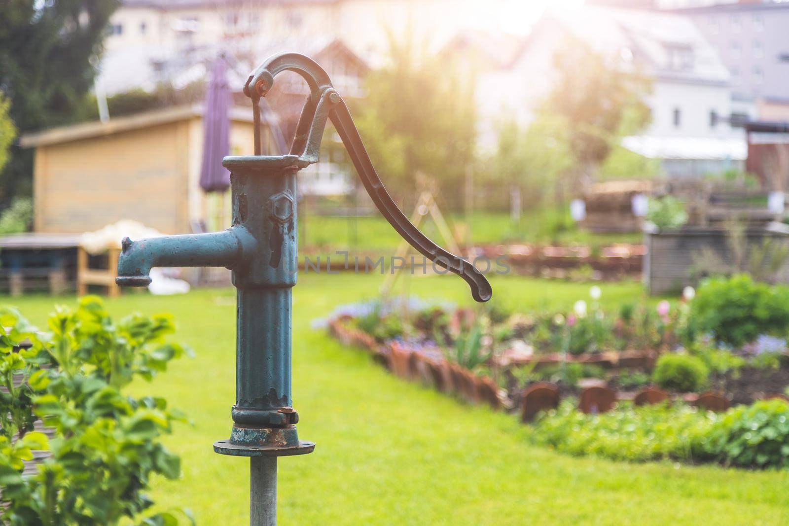 Close up of well for watering urban gardening vegetable patches.