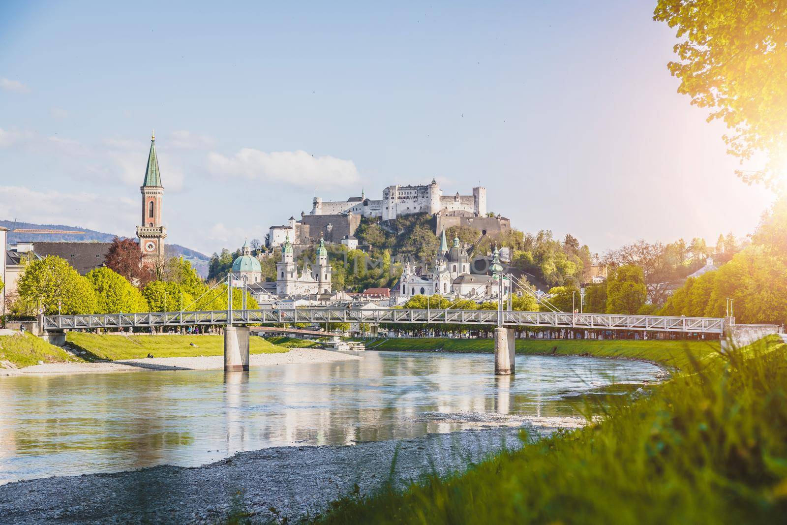 Salzburg summer time: Panoramic city landscape with Salzach with green grass and historic district by Daxenbichler