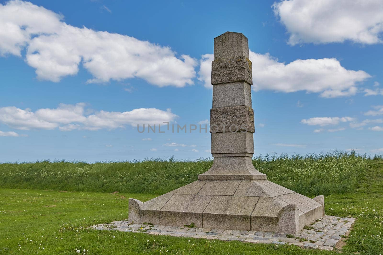 Stone monument Genforeningsmonument near a beach in Fredericia in Denmark by wondry