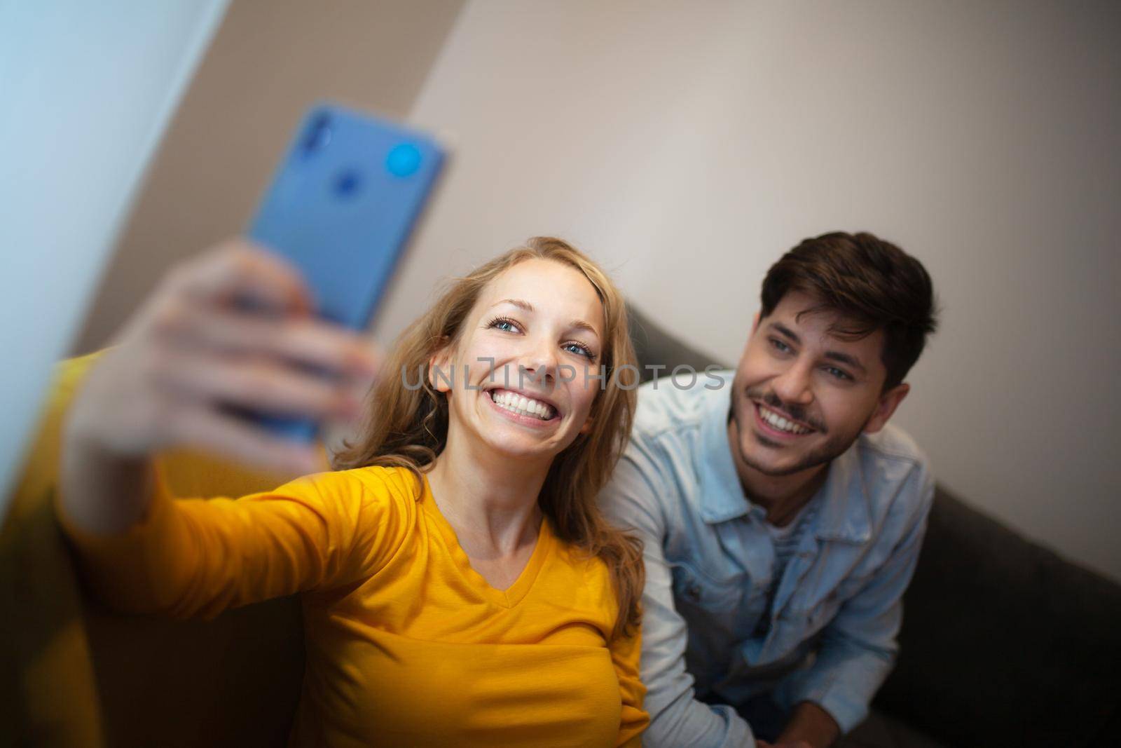 couple in love taking selfie and smiling by kokimk