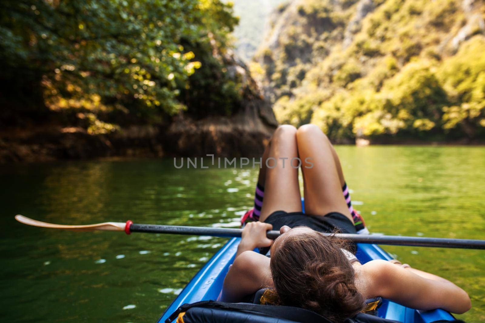 young active girl enjoying a kayak ride