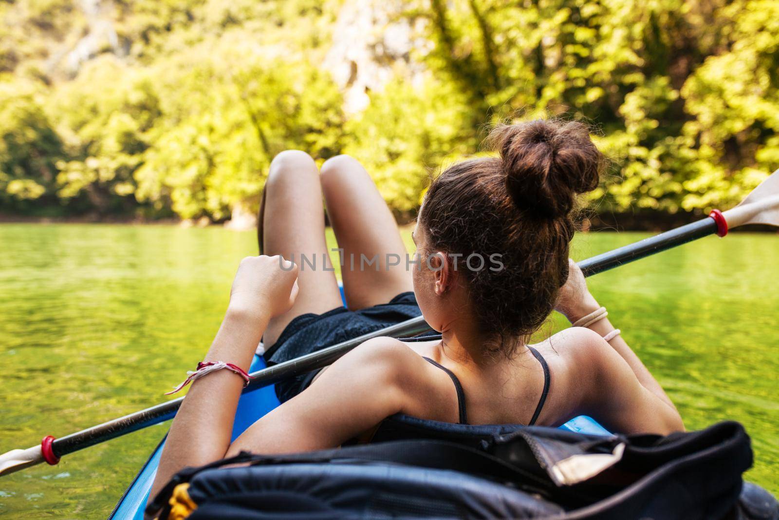 young active girl enjoying a kayak ride