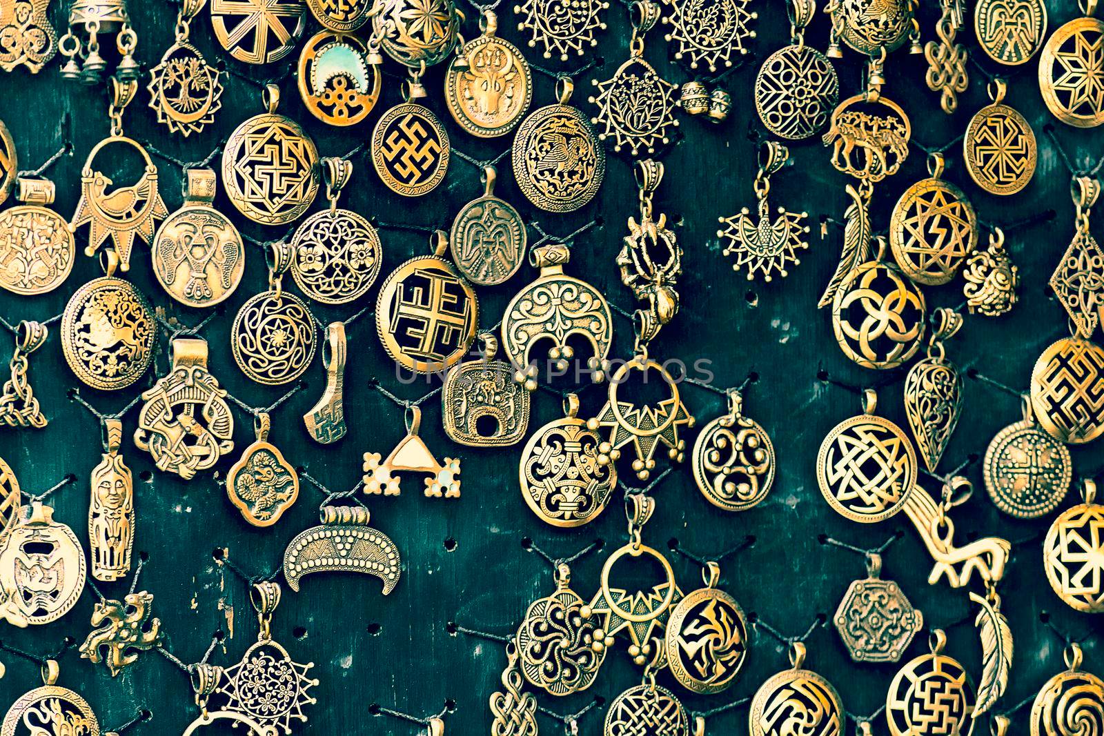 Pendants are handmade medallions on stand. Crimea, Sudak - 10 October 2020. by Essffes