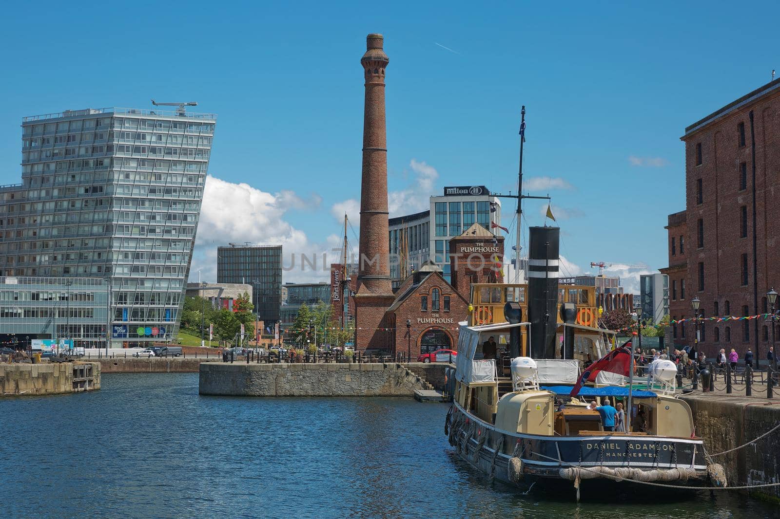 LIVERPOOL, ENGLAND, UK - JUNE 07, 2017: View of Albert Dock in Liverpool, England. The Albert Dock is a complex of dock buildings and warehouses. First non-combustible warehouse system in the world.