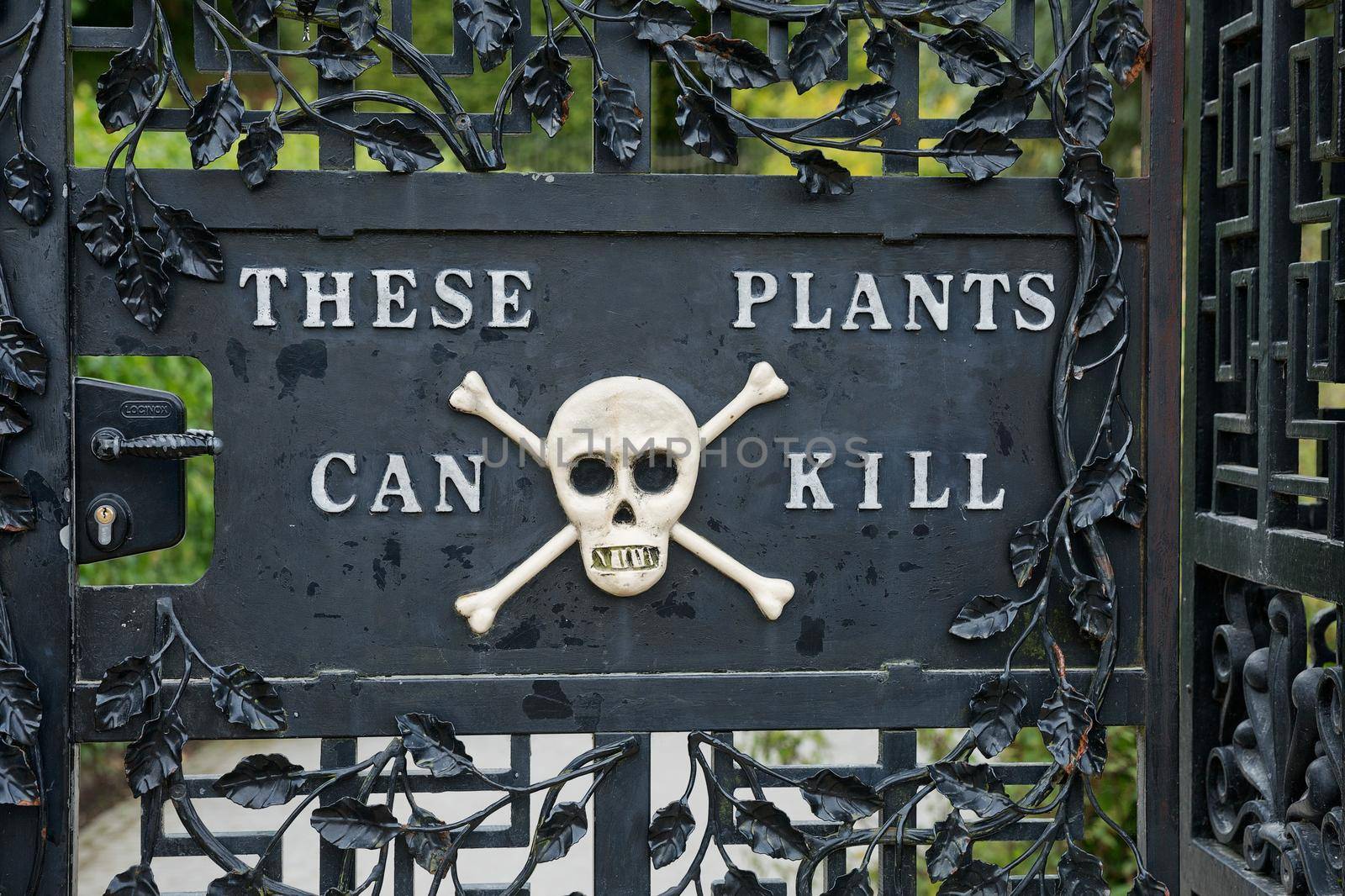 ALNWICK, NORTHUMBERLAND, ENGLAND, UK - SEPTEMBER 10, 2017: Alnwick Garden - entrance into the poison garden. A contemporary pleasure gardens adjacent to Alnwick Castle in Northumberland county in the UK